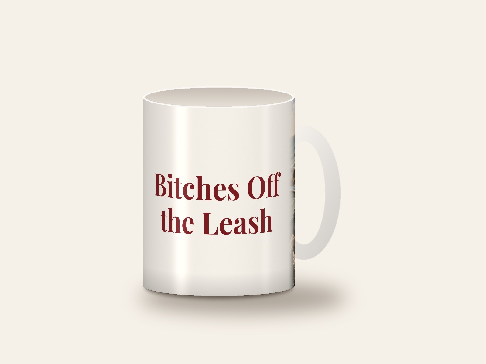 White mug printed with the design Bitches Off the Leash